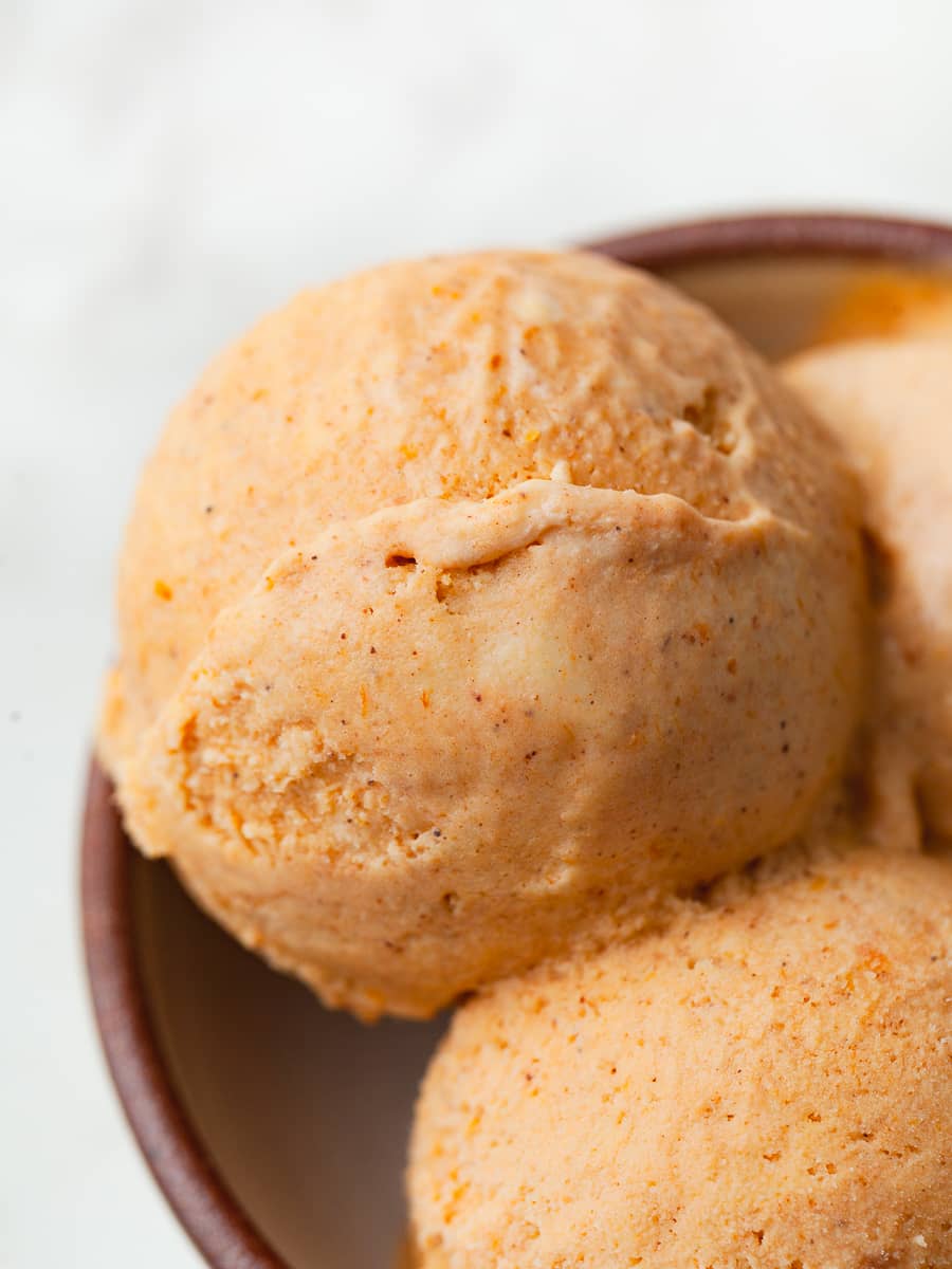 close up of a scoop of no churn pumpkin ice cream