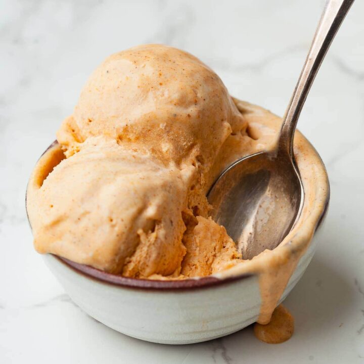 a bowl of gluten free no churn pumpkin ice cream