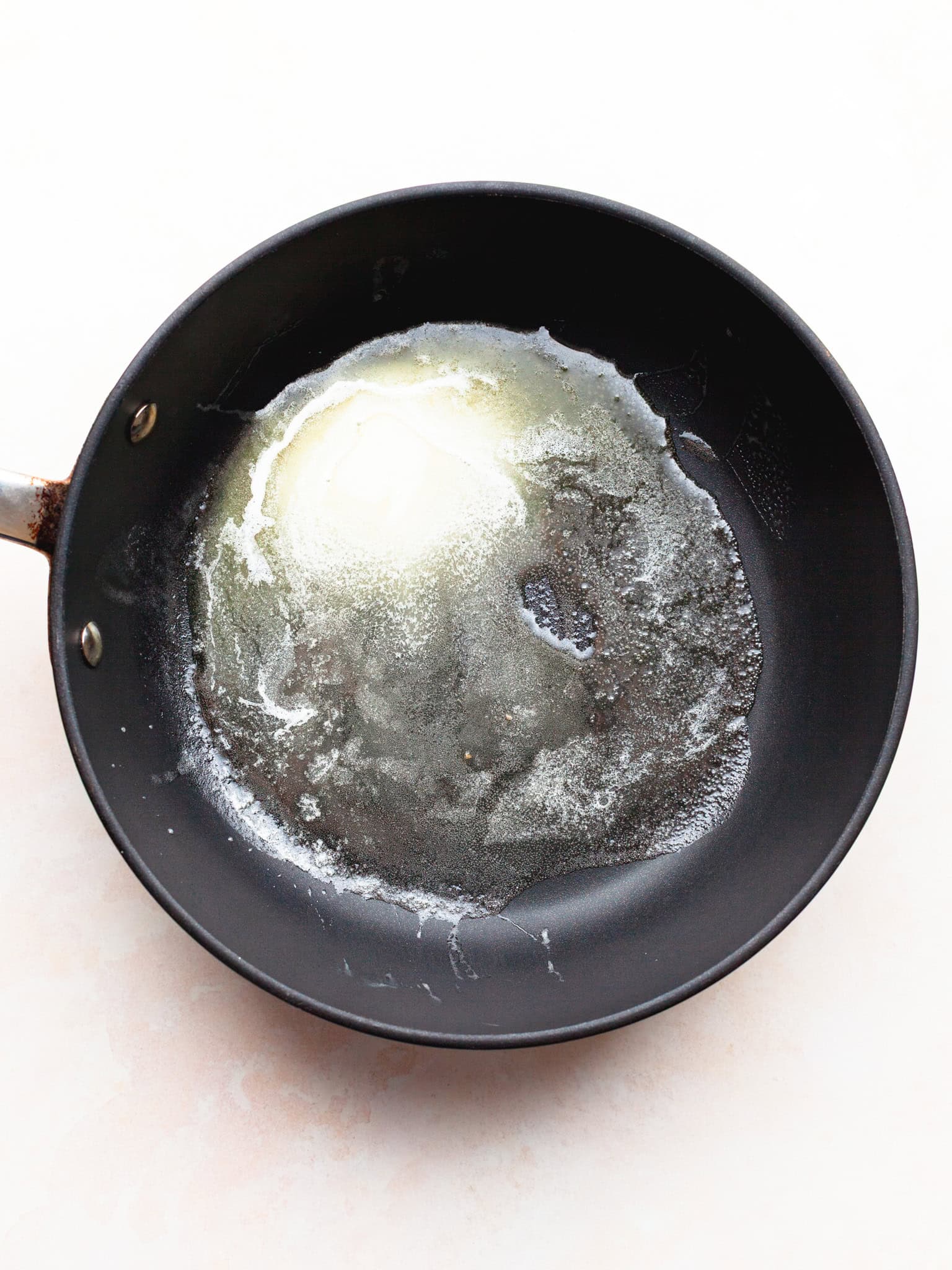 melted butter in an all clad pan