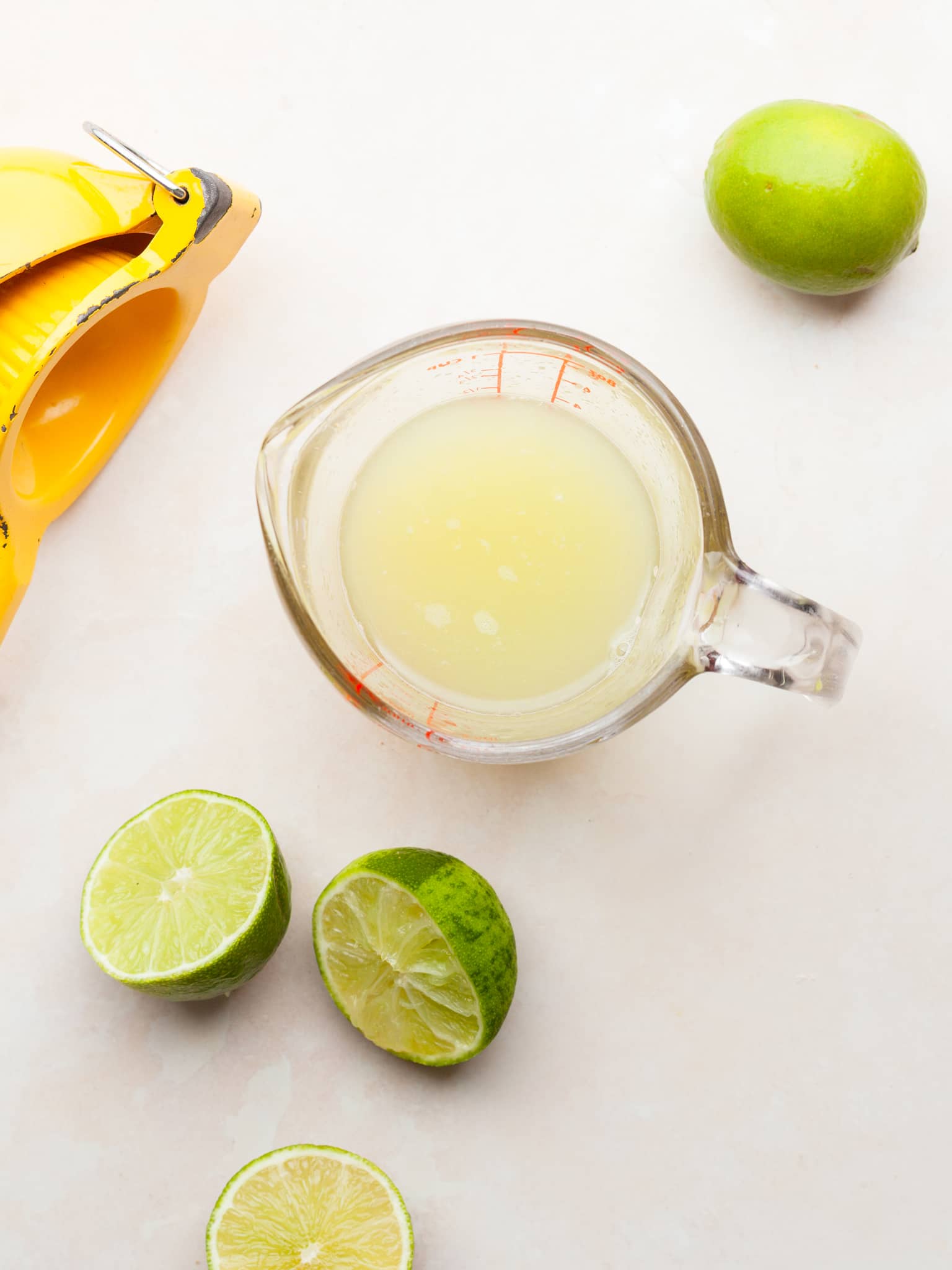 lime juice for gluten free key lime cheesecake mousse in a measuring cup