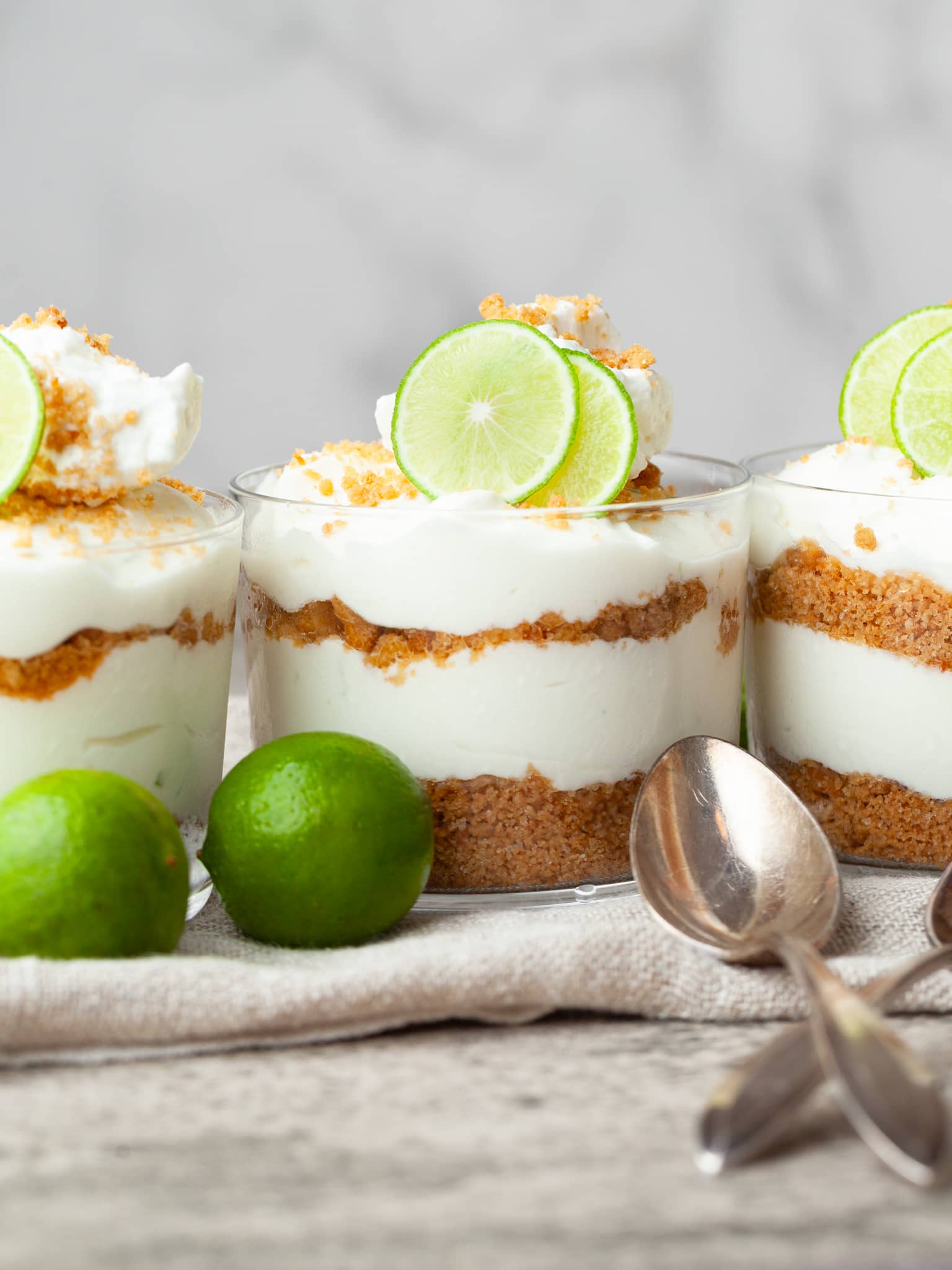 gluten free key lime pie cheesecake mousse in glasses topped with whipped cream