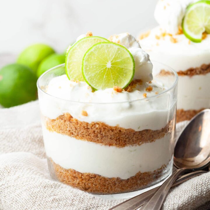 Creamy Gluten Free Key Lime Cheesecake Parfaits layered with buttery graham cracker crumbs. An easy no bake dessert with the perfect balance of sweet and tangy.