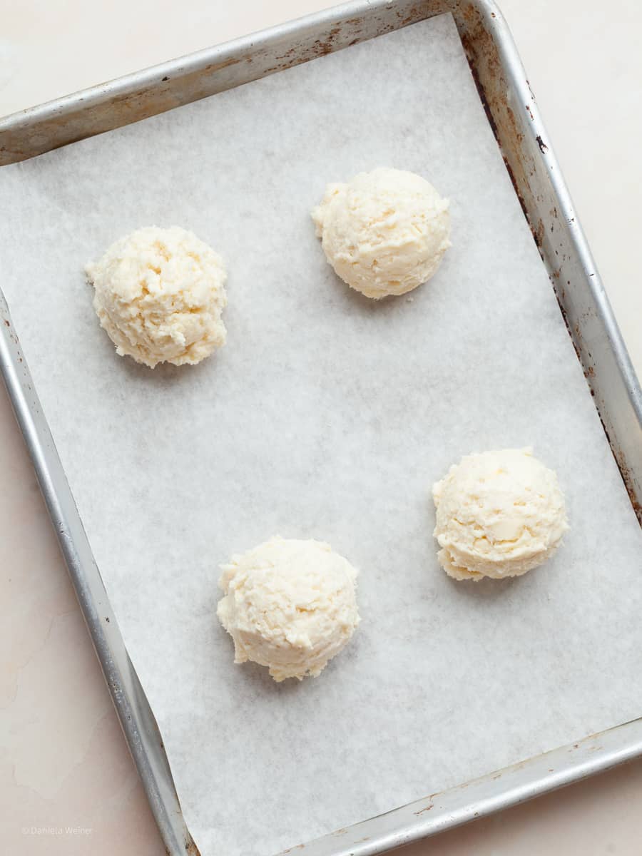 gluten free drop biscuit dough on a sheet tray