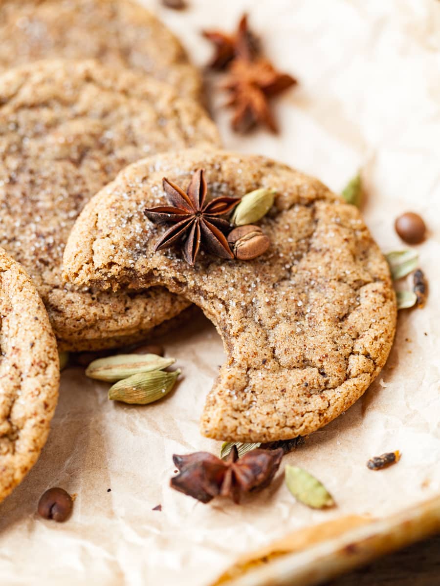 a dirty chai cookie topped with spices on parchment paper