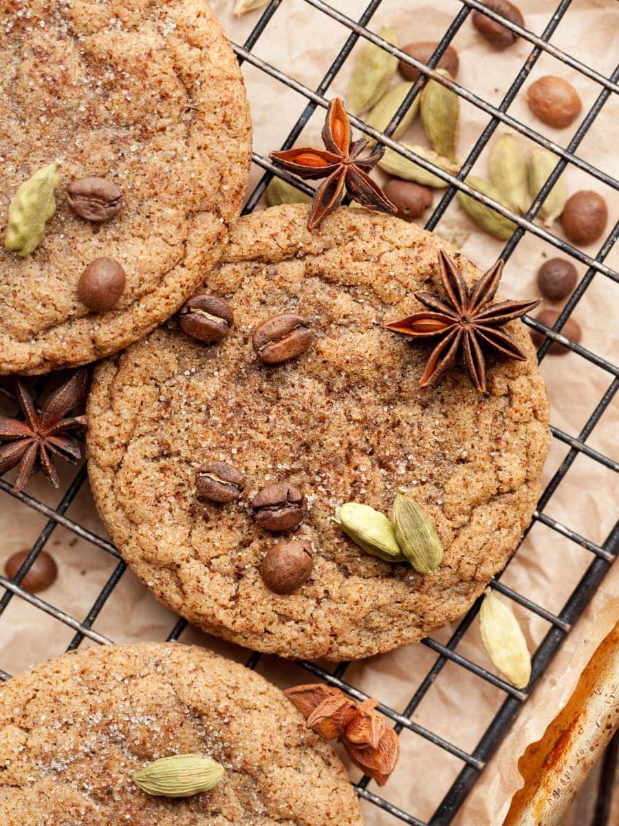 gluten free dirty chai cookies topped with espresso beans, whole cardamonb and star anise
